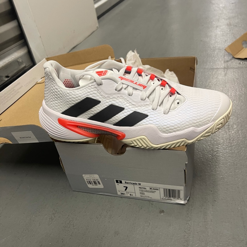 Adidas tennis shose size 7 and 10 women color white black